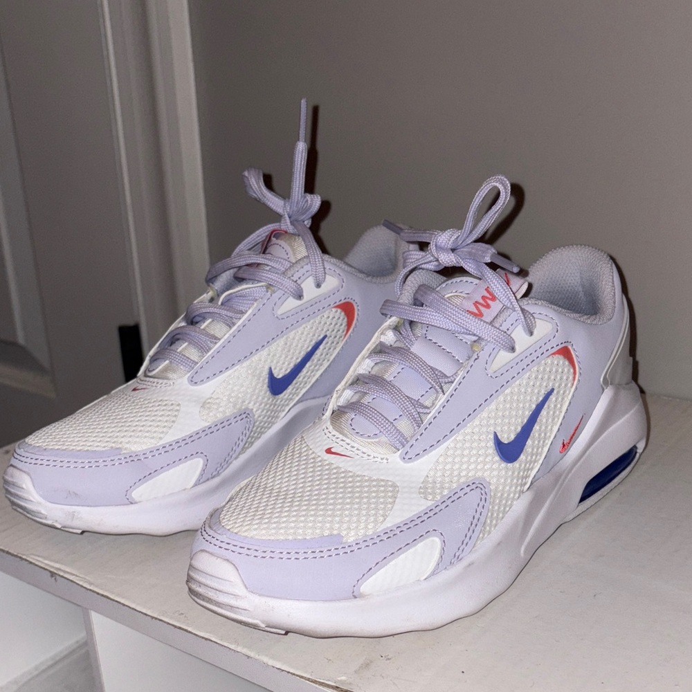 Nike air max bolts women’s in light purple, orange, and dark blue.